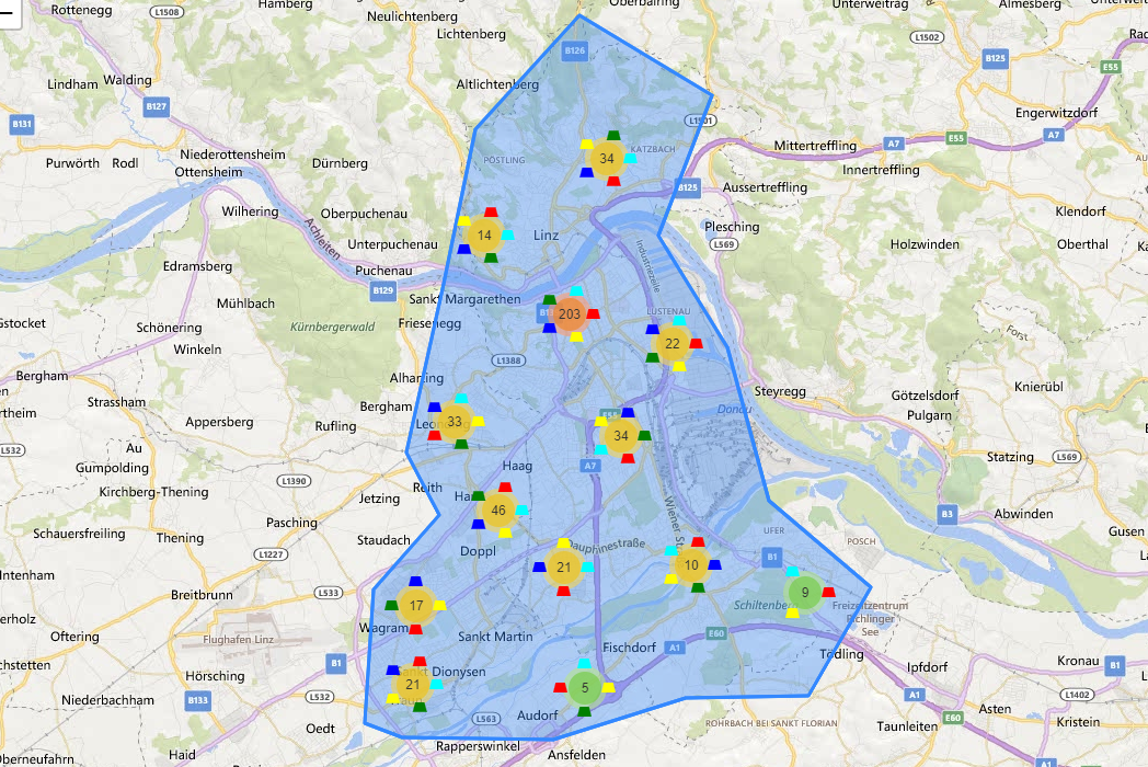 blau markiertes Gebiet auf Landkarte mit farbig gekennzeichneten Punkten